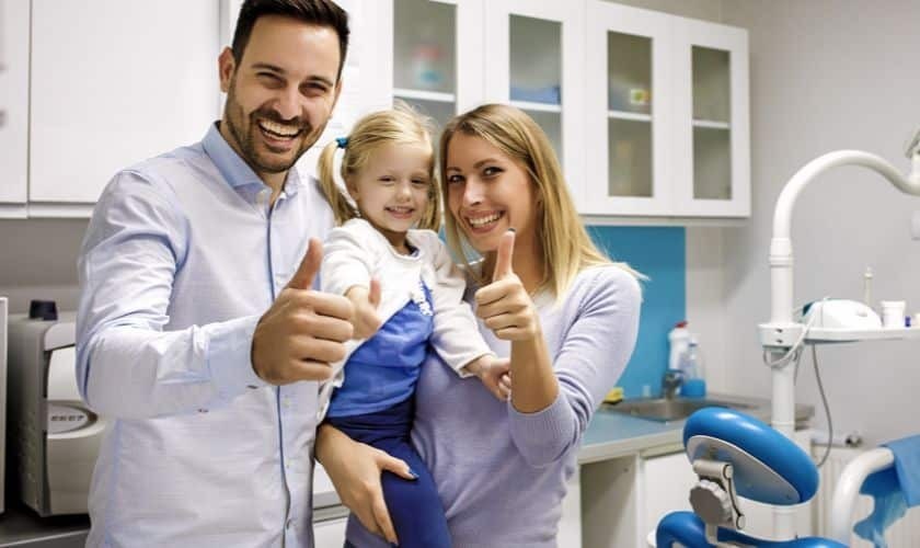 Happy Man with his family for dental care from family dentist in amarillo at Karr & Hardee Dentistry